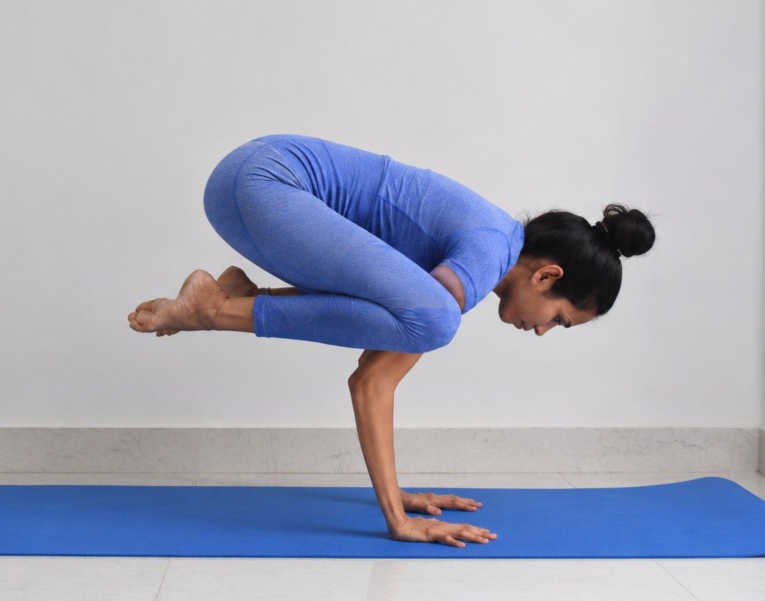 Crow Pose balancing posture demonstrated by Asma Begum