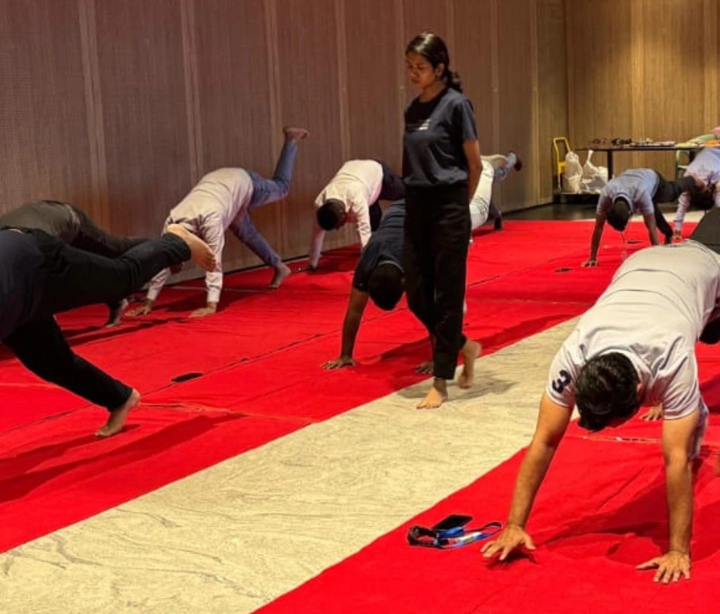 Asma Begum guiding participants during a live yoga workshop by Asma Fitness