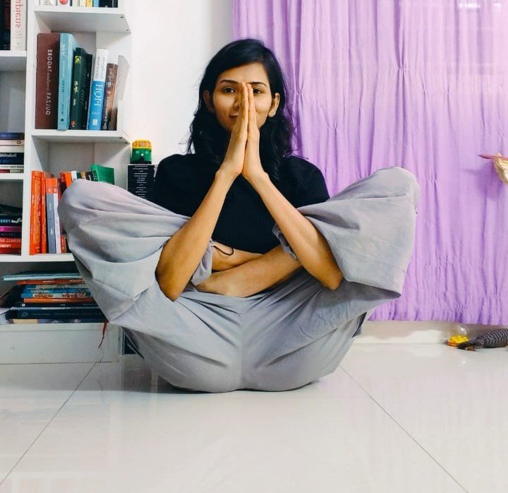 Advanced flexibility yoga pose demonstrated by Asma Begum